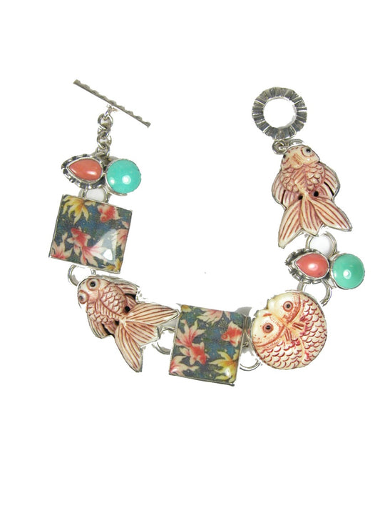 Hand Carved Fossil with Turquoise and Coral Sterling Silver Bracelet