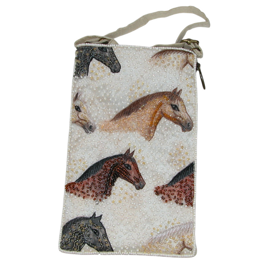 A small zippered pouch or wristlet with a beige strap, featuring an all-over print of horse heads in brown, black, and beige on a light textured background.