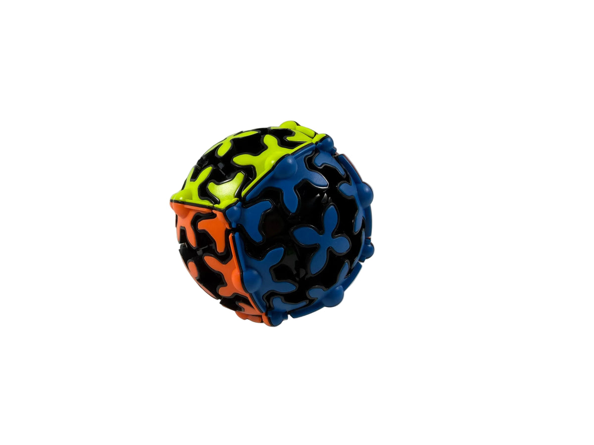 A colorful spherical puzzle ball with interlocking flower-like pieces in black, blue, orange, and neon yellow, photographed on a plain white surface against a white background.